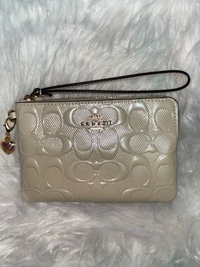 Coach Embossed Leather Wristlet in Pearl Cream with Heart Charm